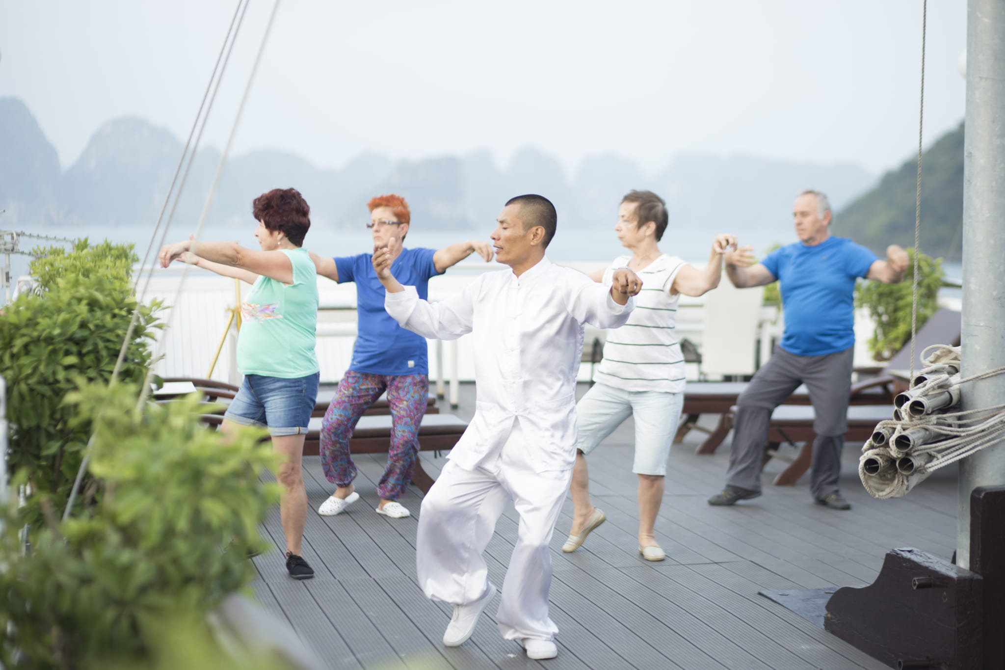 Morning Tai Chi lesson in Halong Cruise